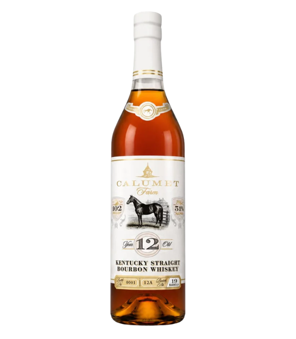 Photograph of a Calumet Farm 12 Year Old Kentucky Straight Bourbon Whiskey bottle with amber liquid, featuring a white label with gold accents, an illustration of a black horse, and the iconic farm barn, prominently displaying 102 proof