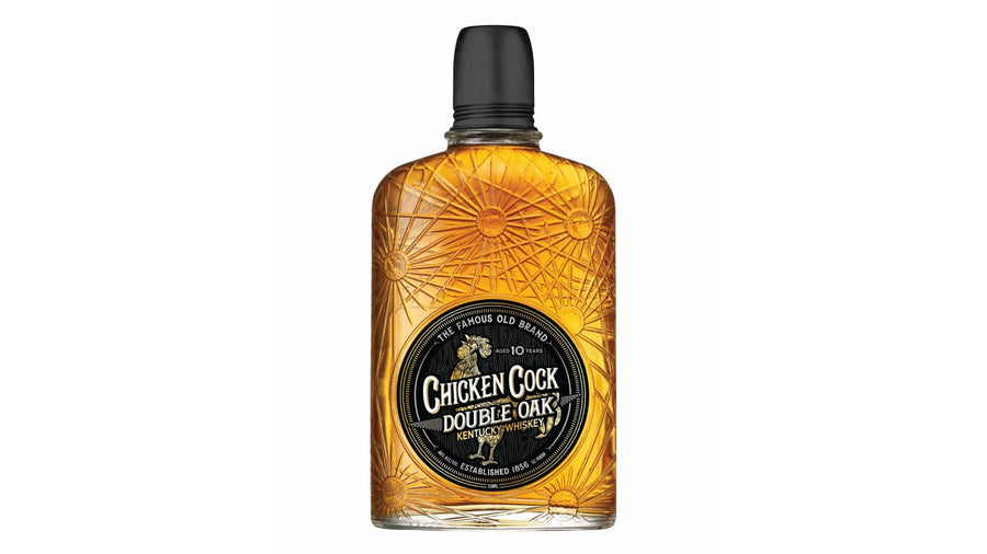 Product photography of a Chicken Cock Double Oak Kentucky Whiskey bottle isolated on a white background, showing clear amber liquid, a radiant sunburst design embossed on the glass, and a vintage black and gold oval label displaying a rooster and "Aged 10 Years"
