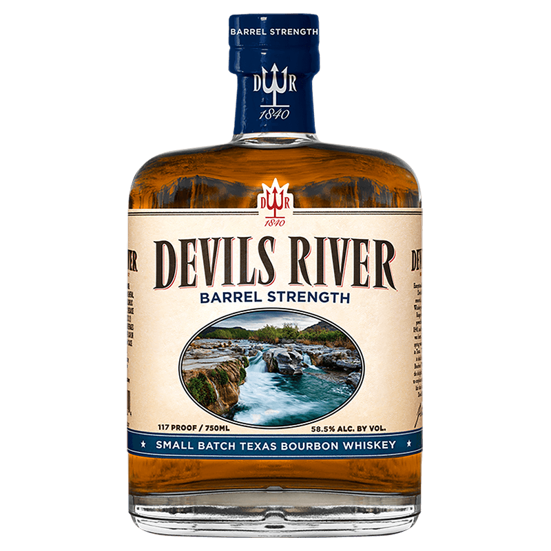 Product photograph of a Devils River Barrel Strength Texas Bourbon Whiskey bottle, filled with amber liquid, featuring a cream label depicting the rugged Devils River flowing over rocks, accented by a dark blue cap with a stylized trident logo and "Small Batch Texas Bourbon Whiskey" text