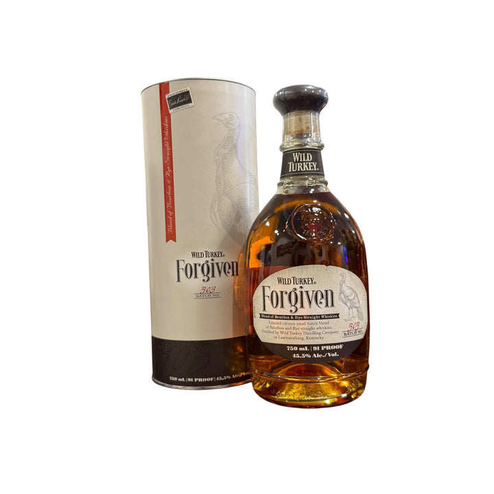 Wild Turkey Forgiven whiskey bottle with amber liquid and its cream cylindrical packaging, featuring a prominent Wild Turkey illustration and Eddie Russell’s signature, detailing it as a blend of Bourbon and Rye Straight Whiskies Batch No 303 from Lawrenceburg Kentucky