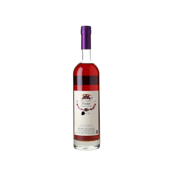 A bottle of Willett Family Estate Single Barrel whiskey from Bardstown Kentucky with a shiny purple foil cap, rich reddish-amber liquid, and a cream label featuring ornate purple and gold scrollwork