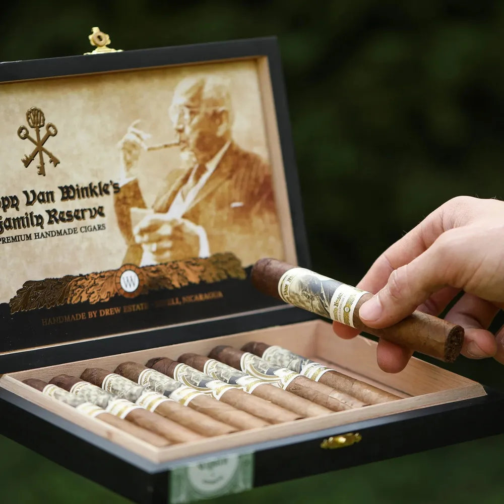 Open box of Pappy Van Winkle Barrel Fermented Cigars, Churchill size, showcasing premium handmade cigars by Drew Estate with bourbon barrel fermentation, perfect for cigar and whiskey lovers.