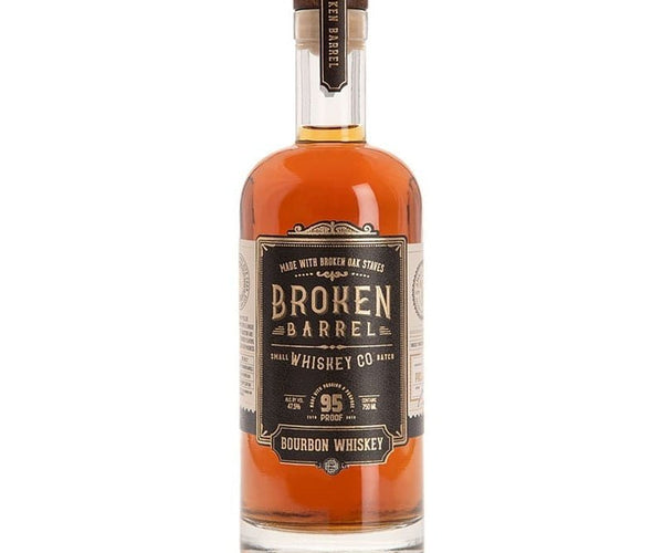 A product image of a Broken Barrel Bourbon Whiskey bottle filled with amber liquid featuring a black and gold label clearly stating 95 proof and Made with Broken Oak Staves against a stark white studio background