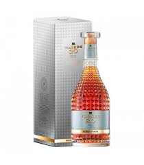 Photograph of a Torres 20 Imperial Brandy bottle with rich amber liquid and a distinctive faceted glass design next to its tall silver presentation box featuring an embossed texture