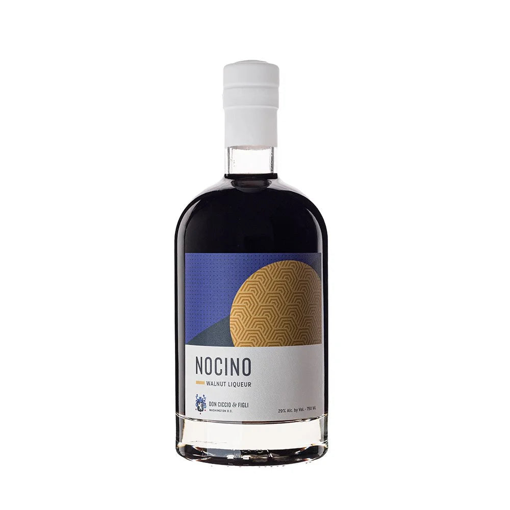 Product photography of a Don Ciccio & Figli Nocino Walnut Liqueur bottle from Washington D.C. with dark liquid, a white cap, and a modern label featuring a blue top and gold geometric half-circle design