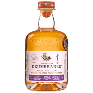Product shot of a Drumshanbo Single Pot Still Tawny Port Cask Irish Whiskey bottle with amber liquid, featuring a white label with a stylized deer emblem and a prominent red-topped cork stopper
